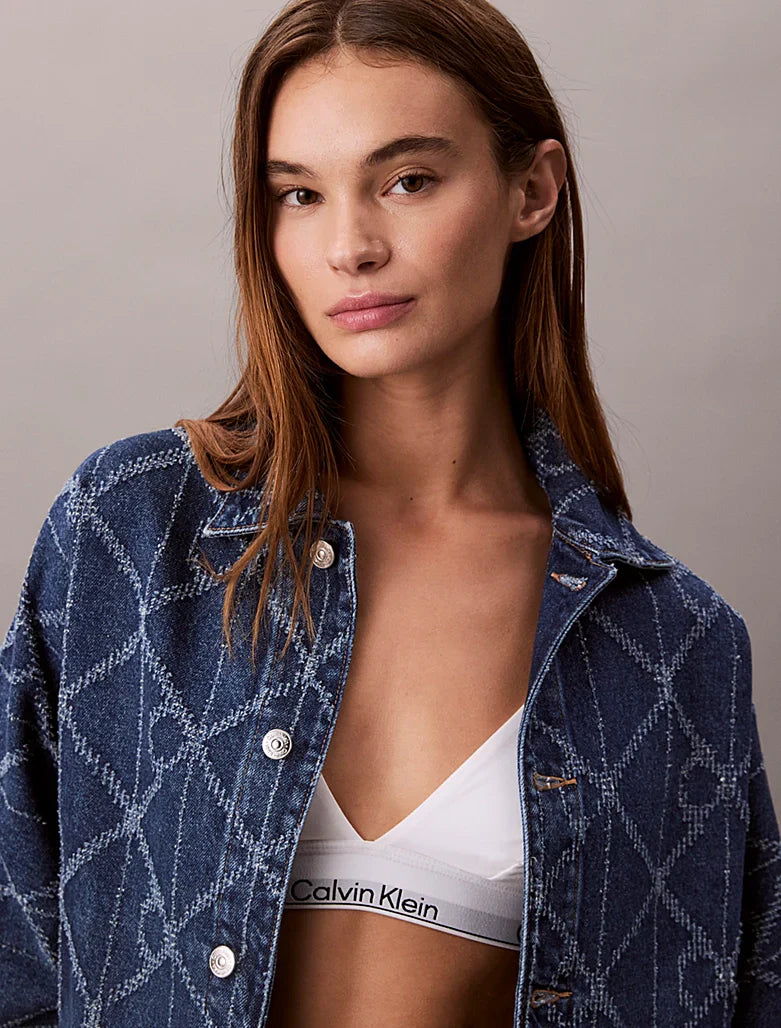 Veste en jean entièrement imprimée de logos